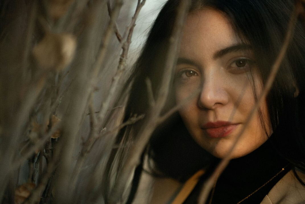 Portrait of a British Indian woman in her thirties with long dark hair
