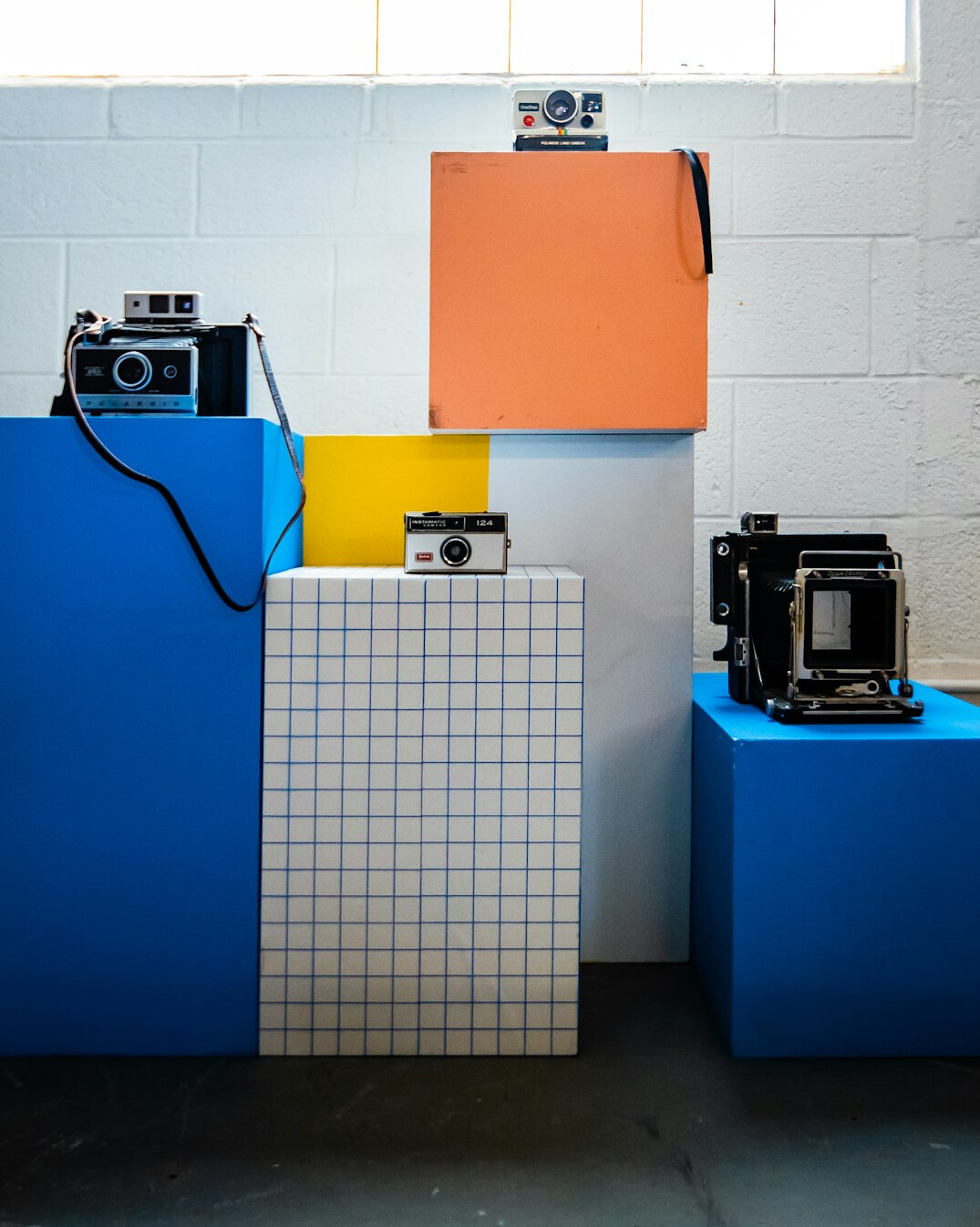Multi-camera television studio set with cameras on pedestals