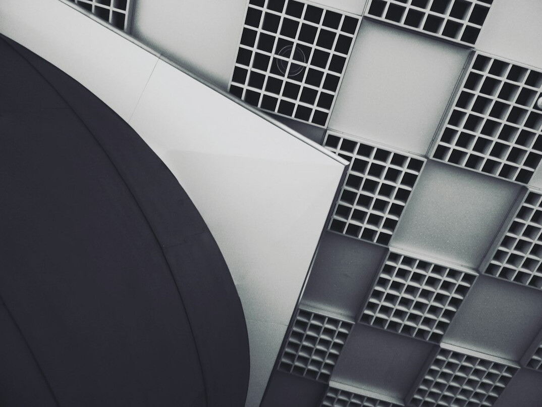 Studio condenser microphone with pop filter in front of acoustic panels