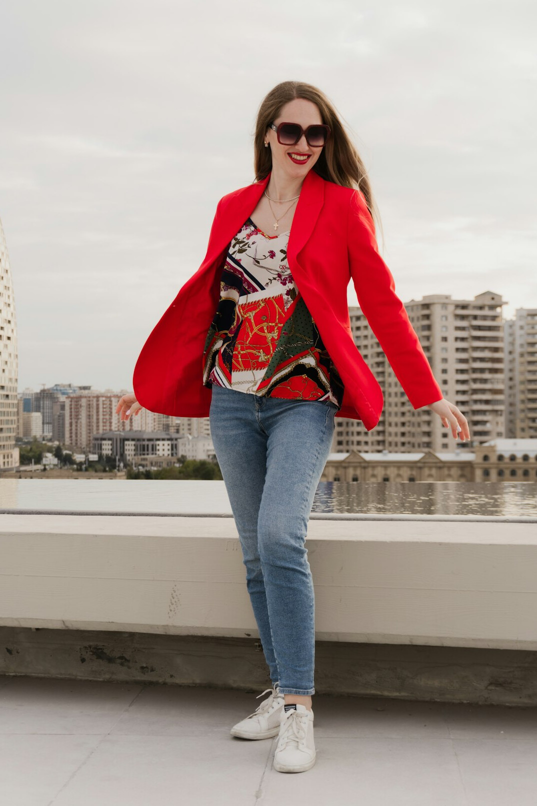 Portrait of a smiling British woman in her forties in a business casual blazer